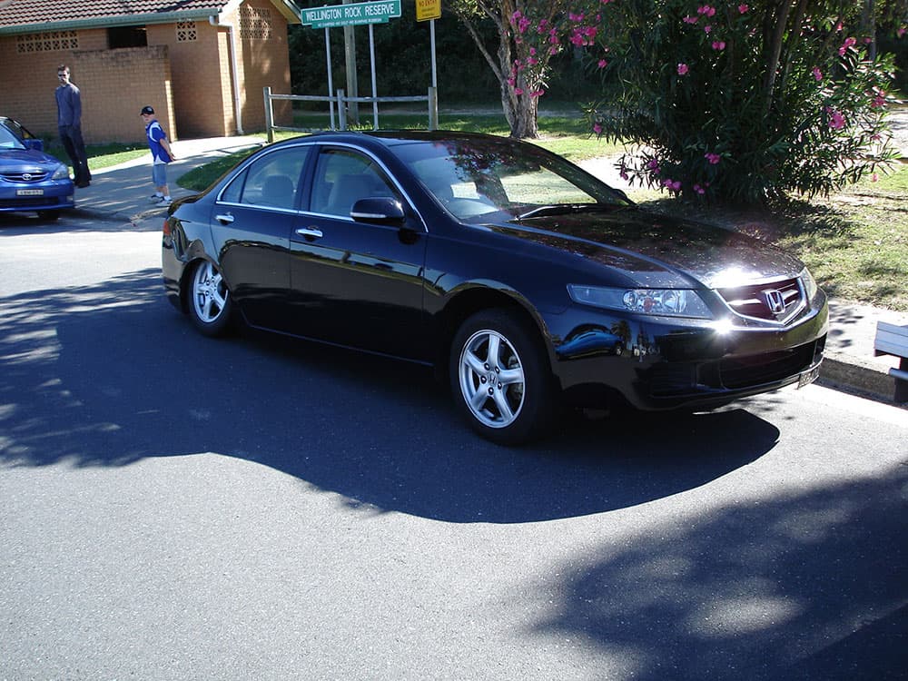 Black lowered Honda Accord Euro sedan with chrome wheels at coastal event parking lot at Half Way Havoc 2006 Nambucca Heads NSW - Minitruck Show Photos