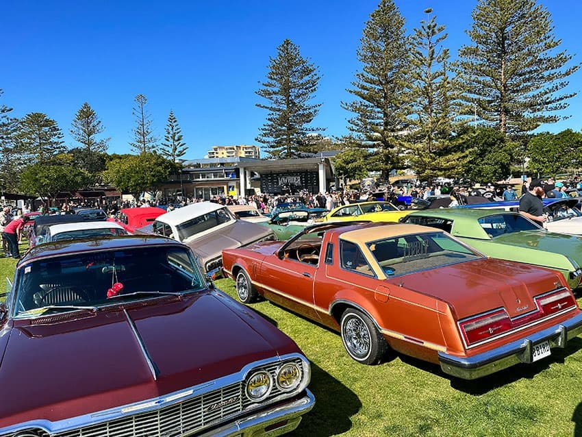 Custom lowrider with detailed chrome work at Memorial Park The Entrance 2023