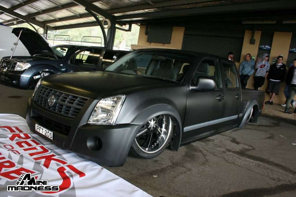 Matte black Australian extended cab truck with chrome wheels at covered pavilion Mini Madness 2011