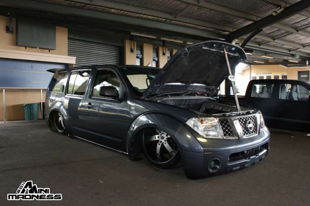 Charcoal grey minitruck with hood open showing engine modifications at Mini Madness 2011
