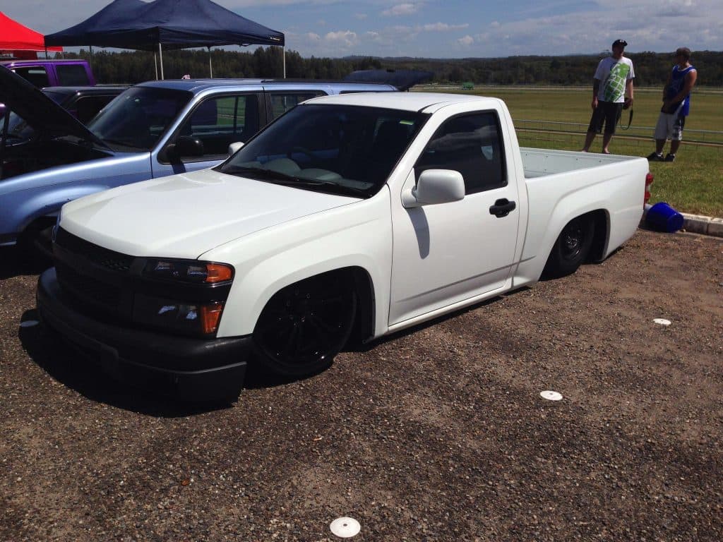White slammed Holden Rodeo with Colorado front end swap and black wheels on gravel at Port Macquarie raceway Mini Madness 2014